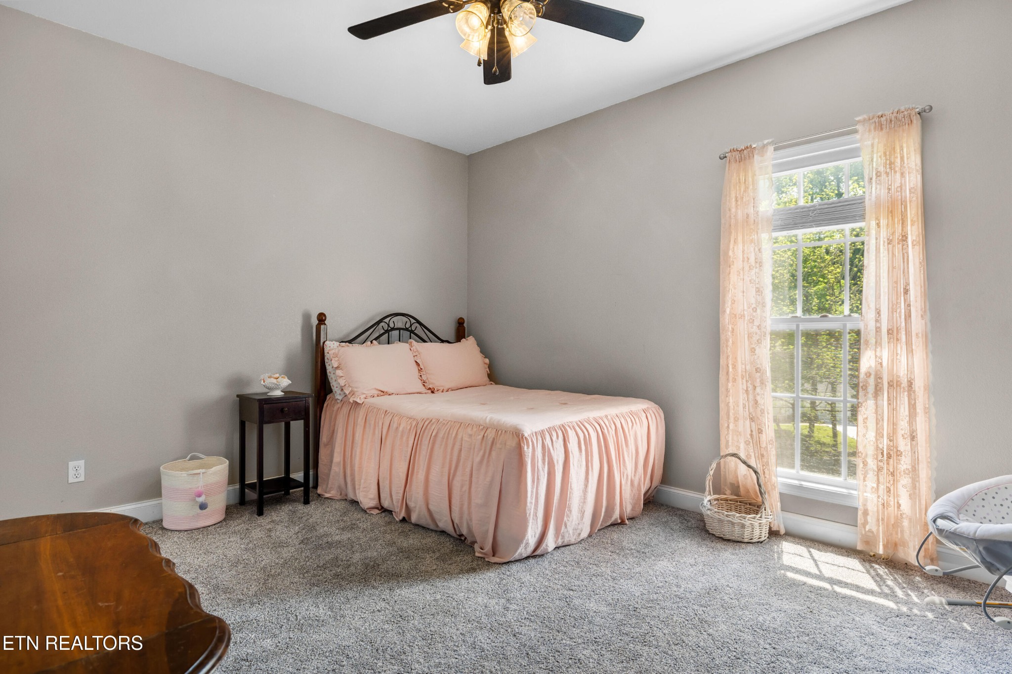349 Rudd Hollow Road Townsend, TN 37882 - Photo 36 of 52 a bedroom with a bed and a chandelier