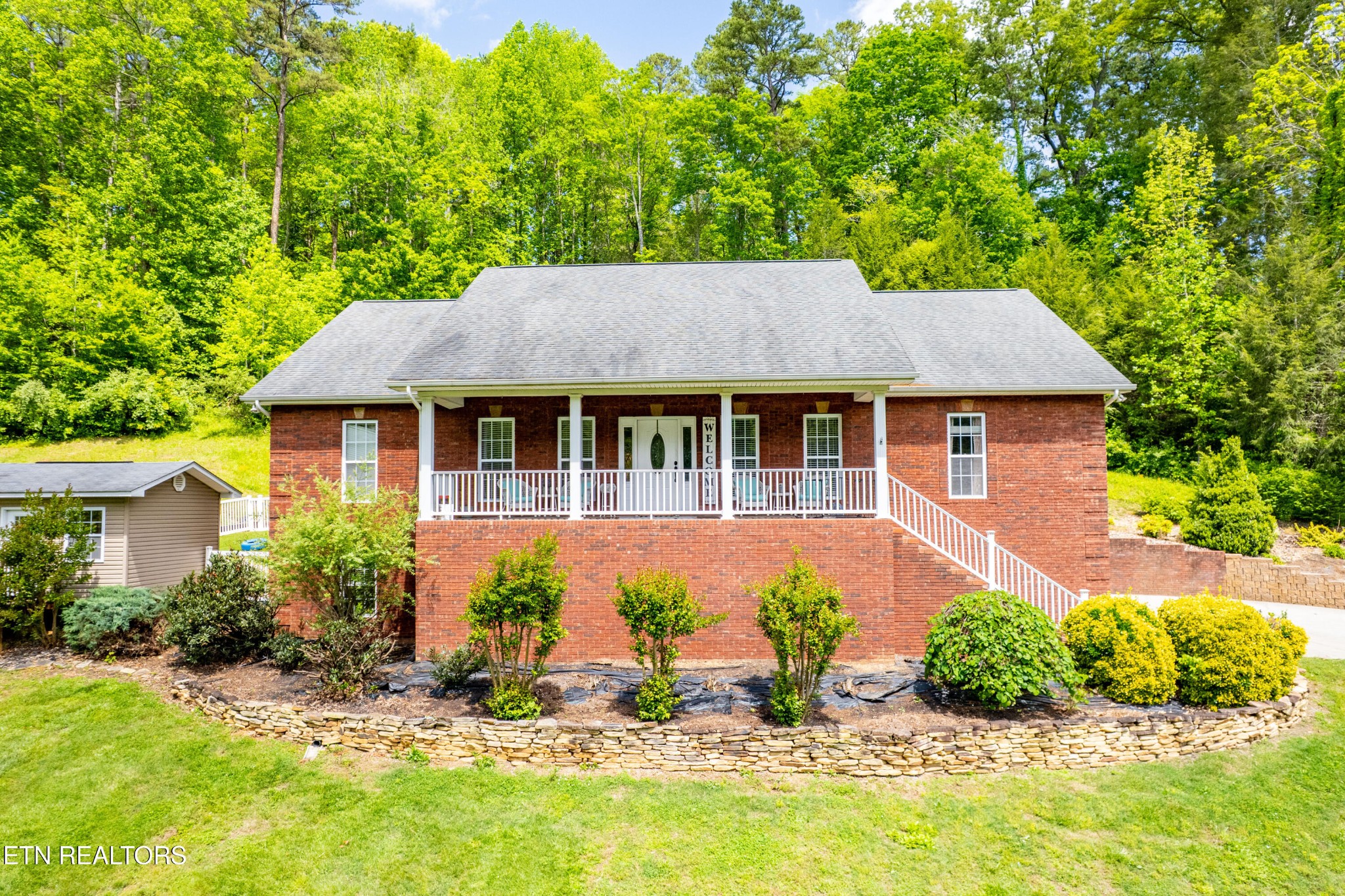 349 Rudd Hollow Road Townsend, TN 37882 - Photo 4 of 52 a front view of a house with a garden