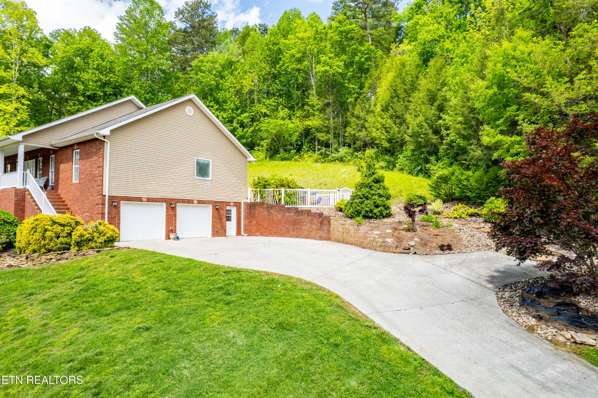 349 Rudd Hollow Road Townsend, TN 37882 - Photo 6 of 52 a view of a house with a yard and potted plants