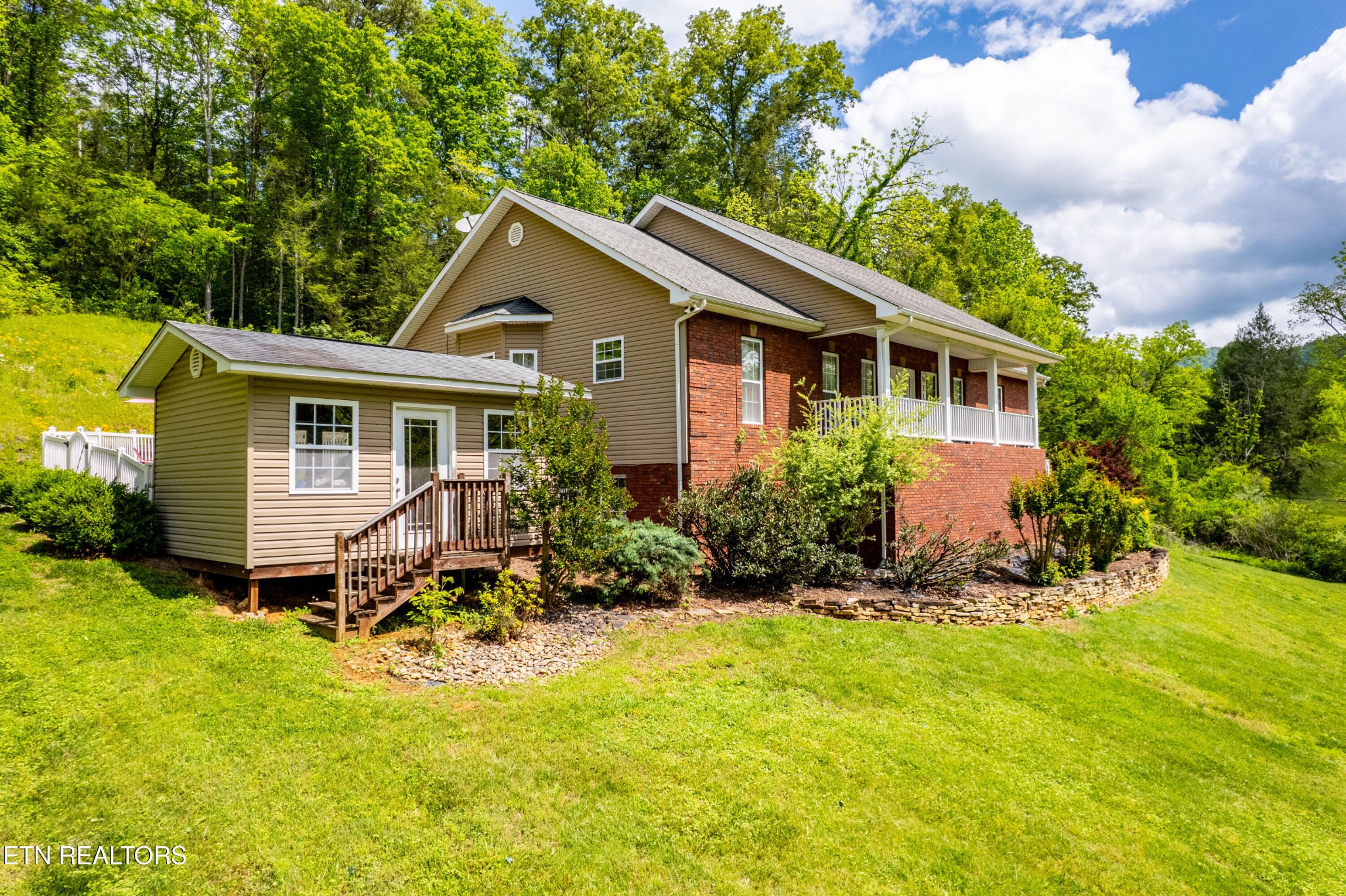349 Rudd Hollow Road Townsend, TN 37882 - Photo 7 of 52 a house view with a garden space