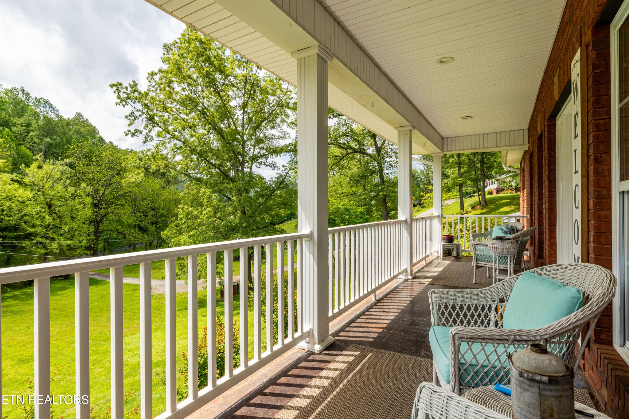 349 Rudd Hollow Road Townsend, TN 37882 - Photo 8 of 52 a view of a chairs and table in the balcony