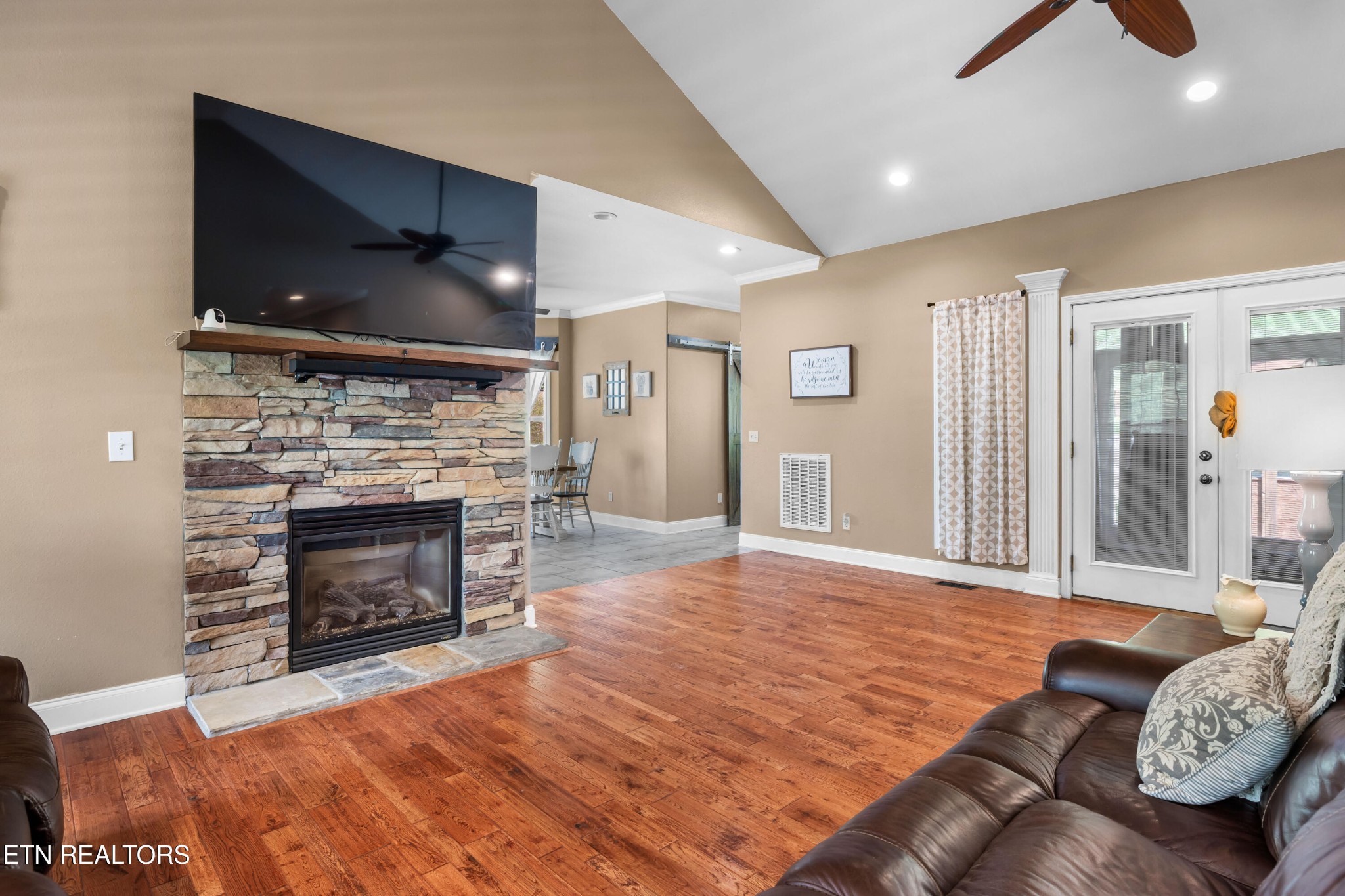 349 Rudd Hollow Road Townsend, TN 37882 - Photo 10 of 52 a living room with furniture a flat screen tv and a fireplace