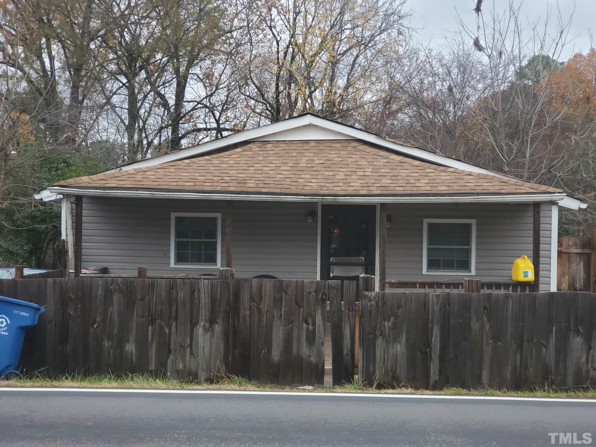 a front view of house with trees