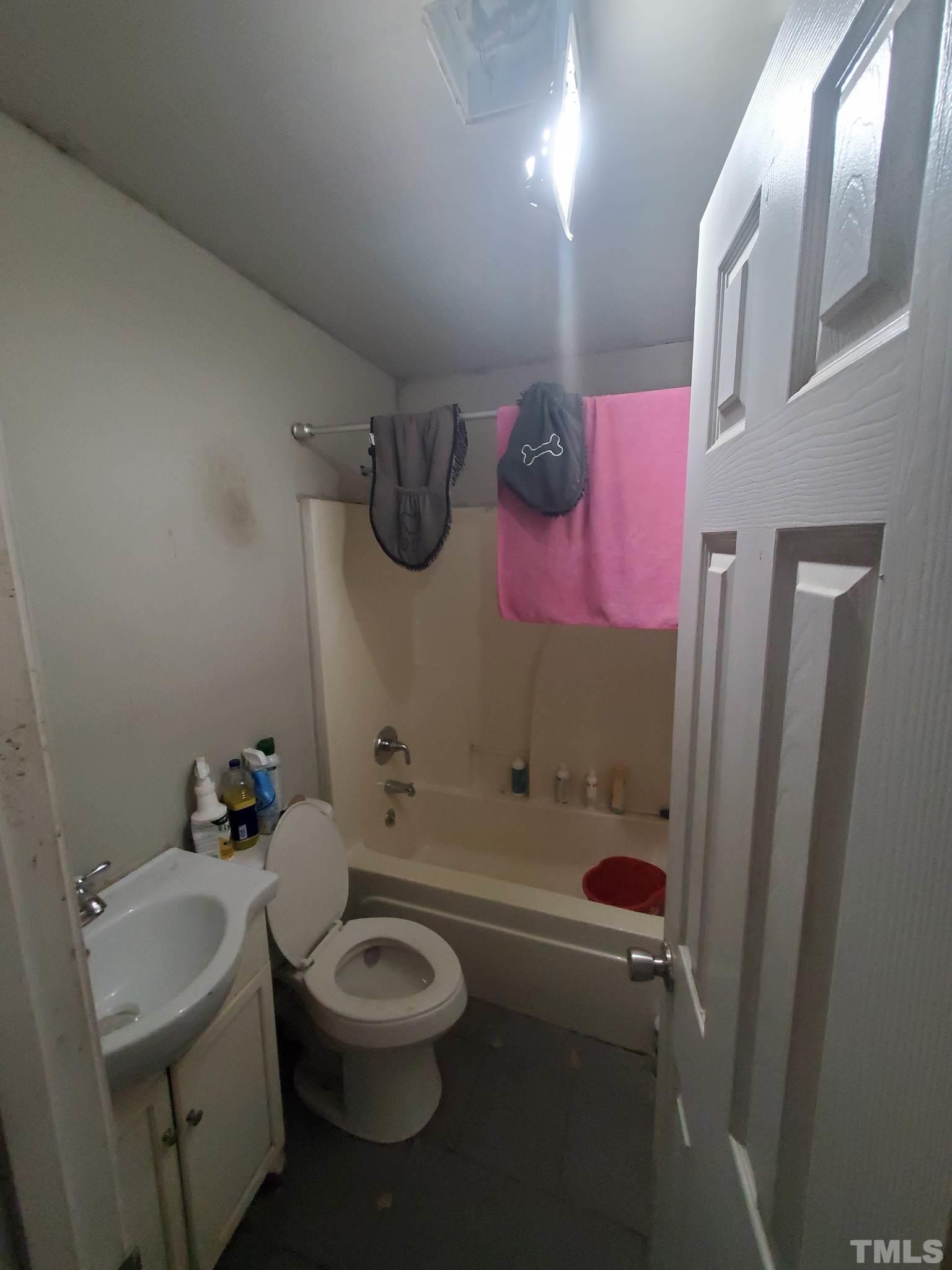 3600 Dearborn Drive Durham, NC 27704 - Photo 13 of 13 a bathroom with a sink a toilet and shower