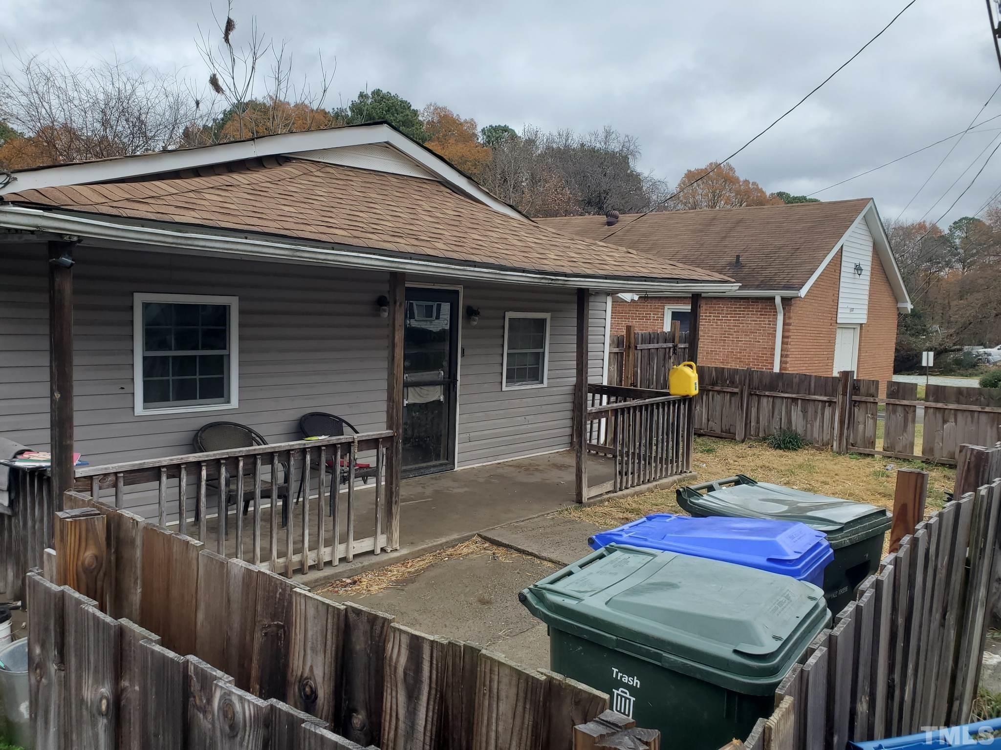 3600 Dearborn Drive Durham, NC 27704 - Photo 2 of 13 a view of a chairs and table on the deck