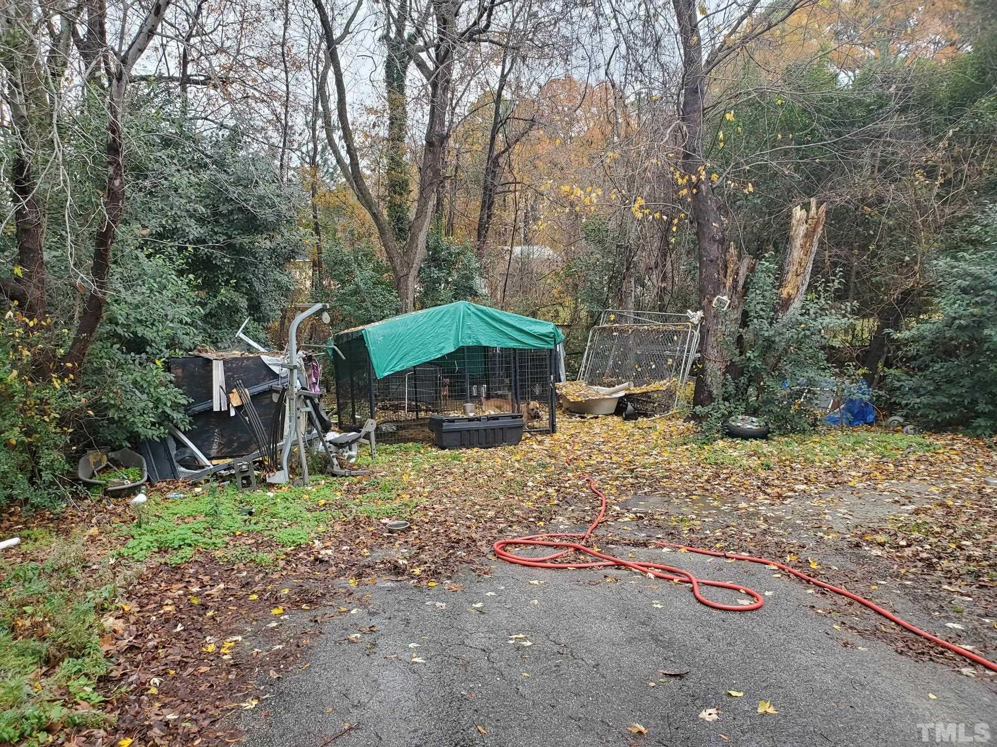 3600 Dearborn Drive Durham, NC 27704 - Photo 5 of 13 a view of a backyard with large trees