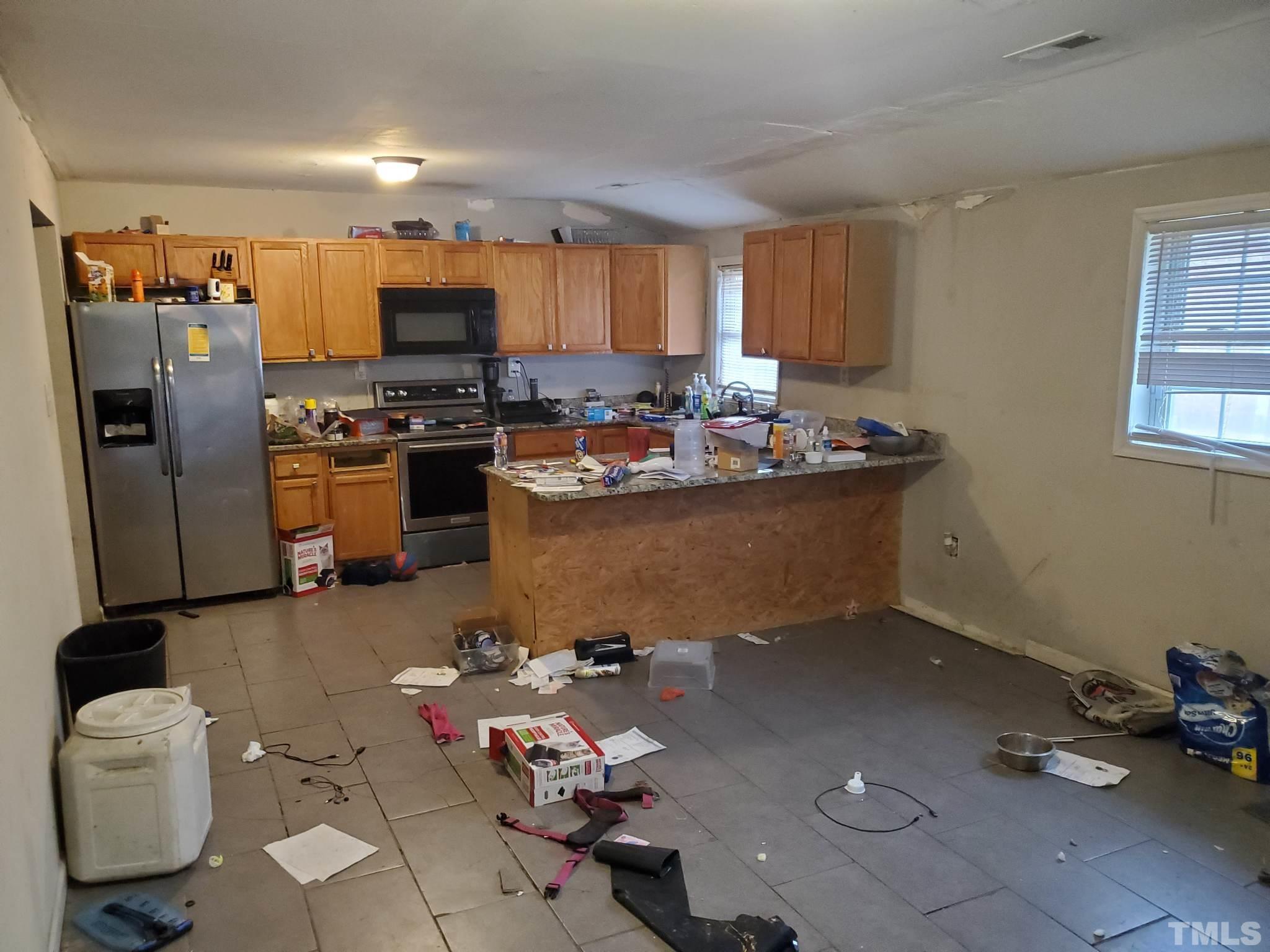 3600 Dearborn Drive Durham, NC 27704 - Photo 8 of 13 a kitchen with a sink and appliances