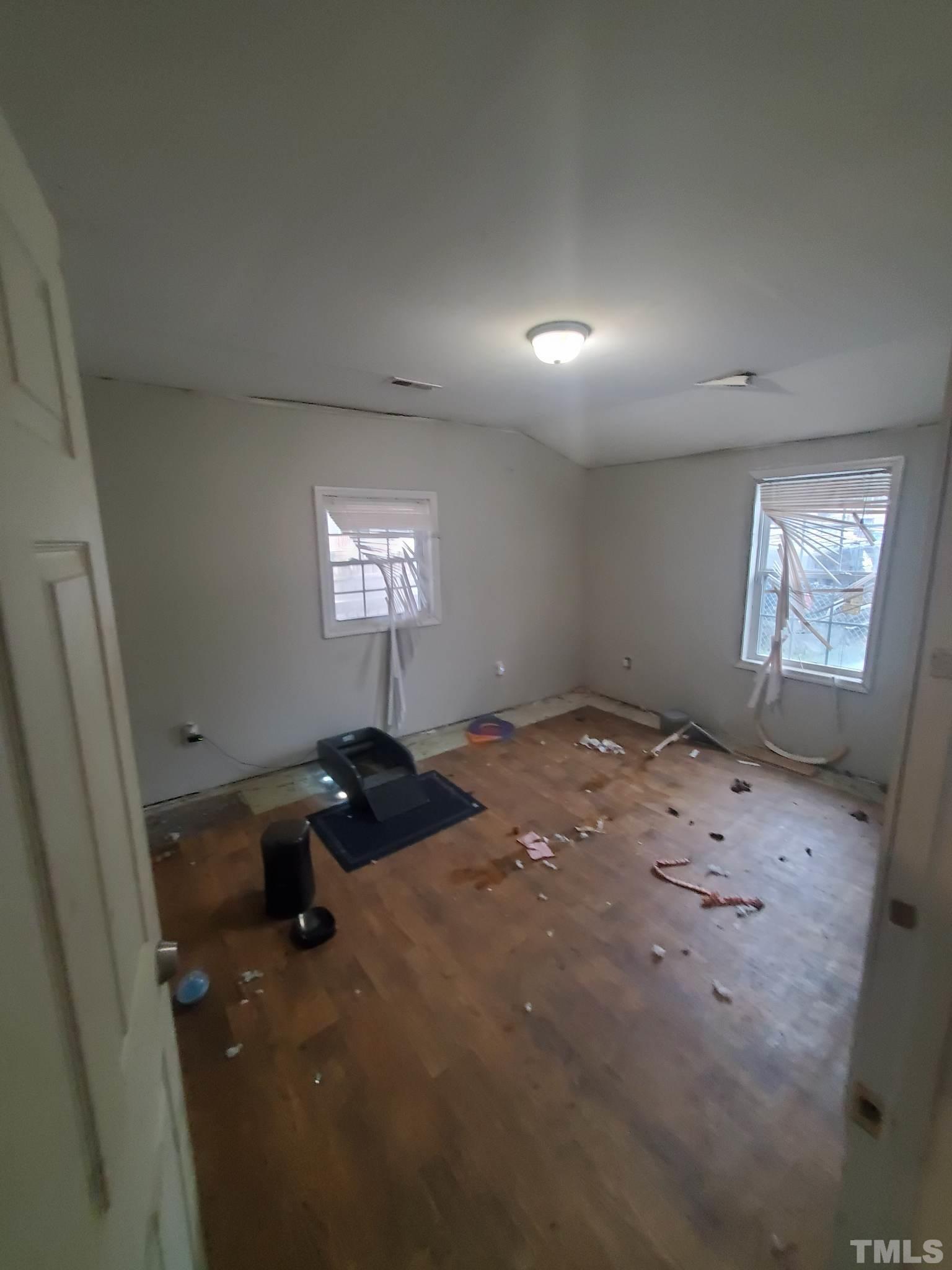 3600 Dearborn Drive Durham, NC 27704 - Photo 10 of 13 a bedroom with a bed and window