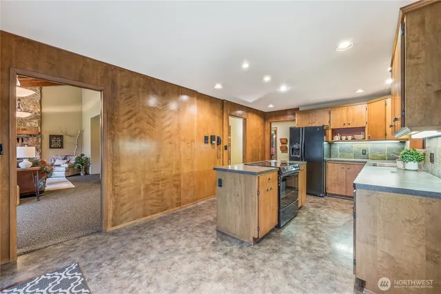 a view of a kitchen with furniture and a kitchen