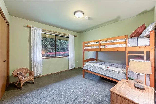 a bedroom with furniture and a window