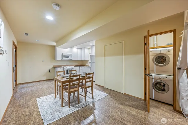 a view of a dining room with furniture and wooden floor