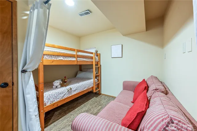 a bed room with a bed and a window