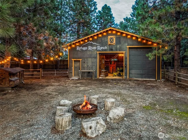 a front view of a house with a yard table and chairs