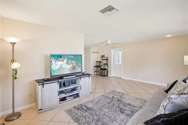 a view of a livingroom with furniture wooden floor and chandelier