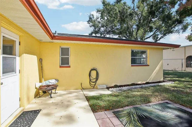 a kitchen with a sink a refrigerator and cabinets