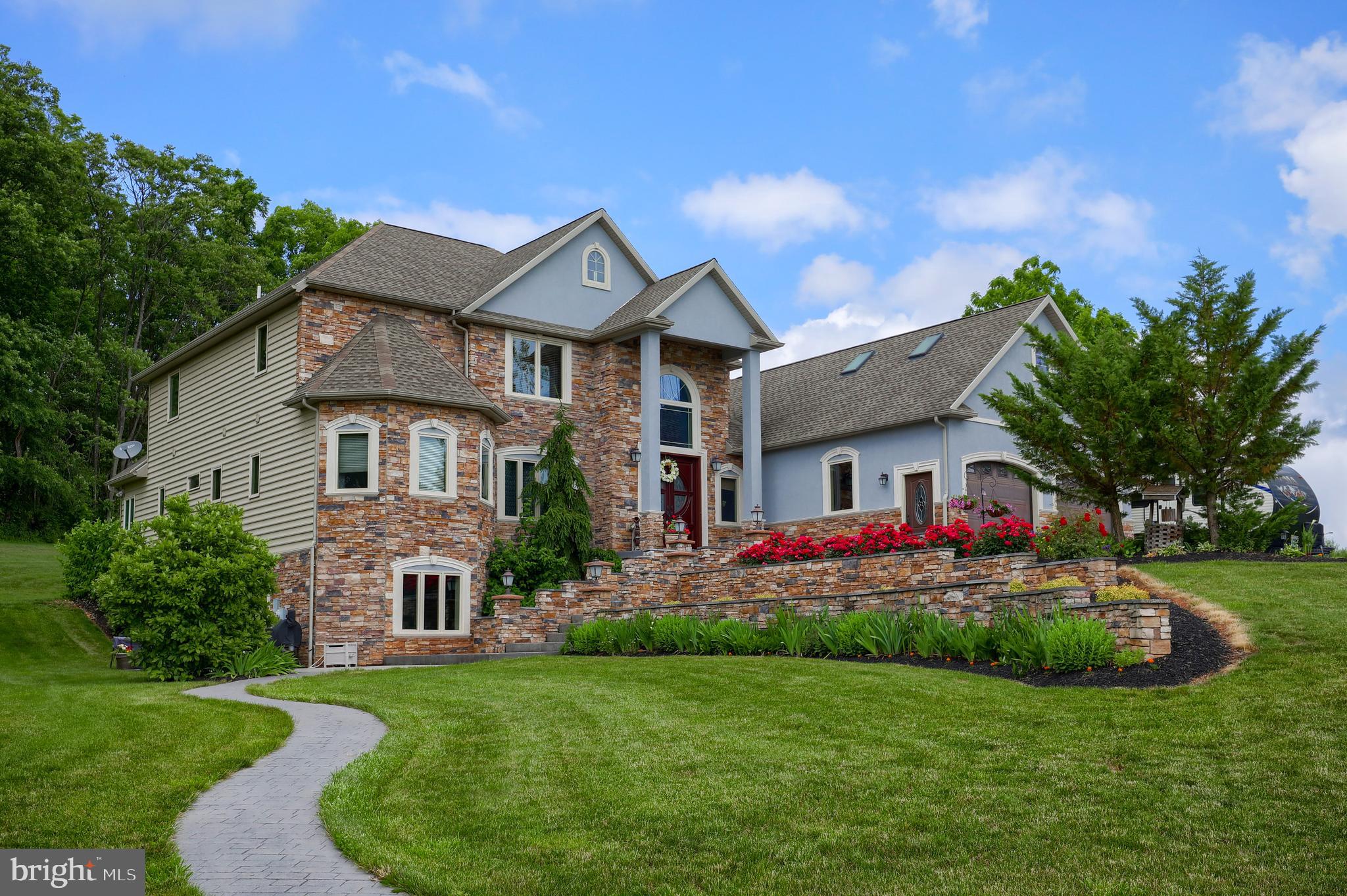 70 Horseshoe Trail Road Denver, PA 17517 - Photo 1 of 128 a front view of house with yard and green space