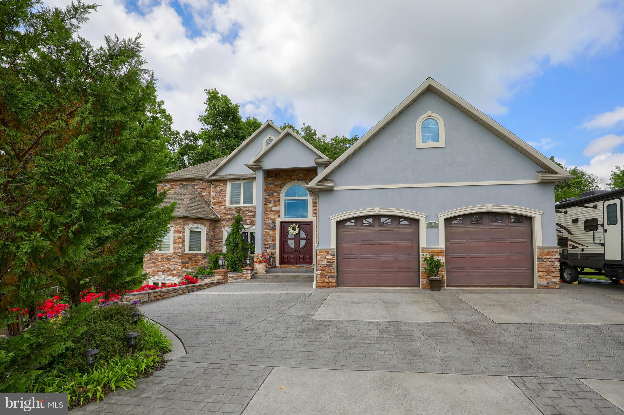 70 Horseshoe Trail Road Denver, PA 17517 - Photo 11 of 128 a front view of a house with a yard and garage