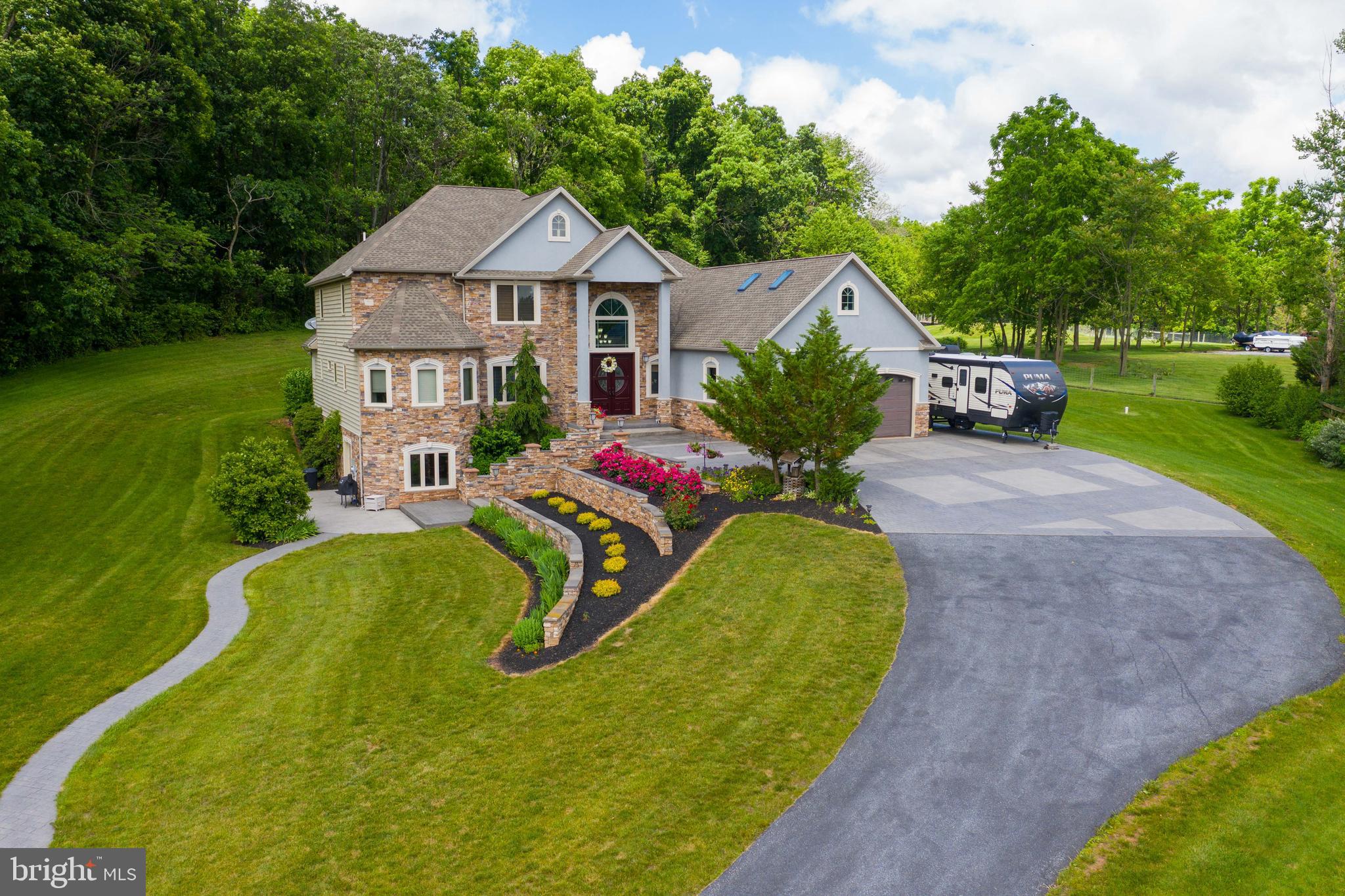 70 Horseshoe Trail Road Denver, PA 17517 - Photo 107 of 128 a front view of a house with garden