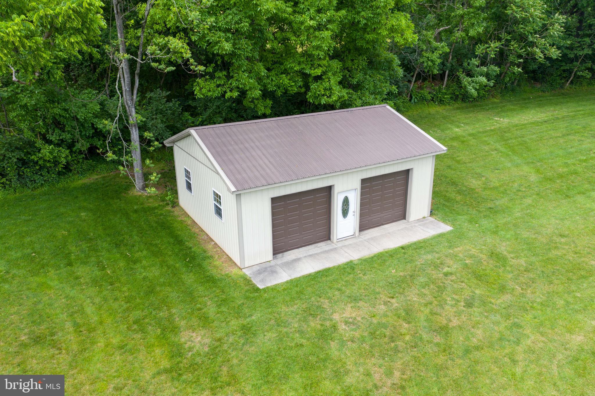 70 Horseshoe Trail Road Denver, PA 17517 - Photo 121 of 128 a aerial view of a house with a yard table and chairs