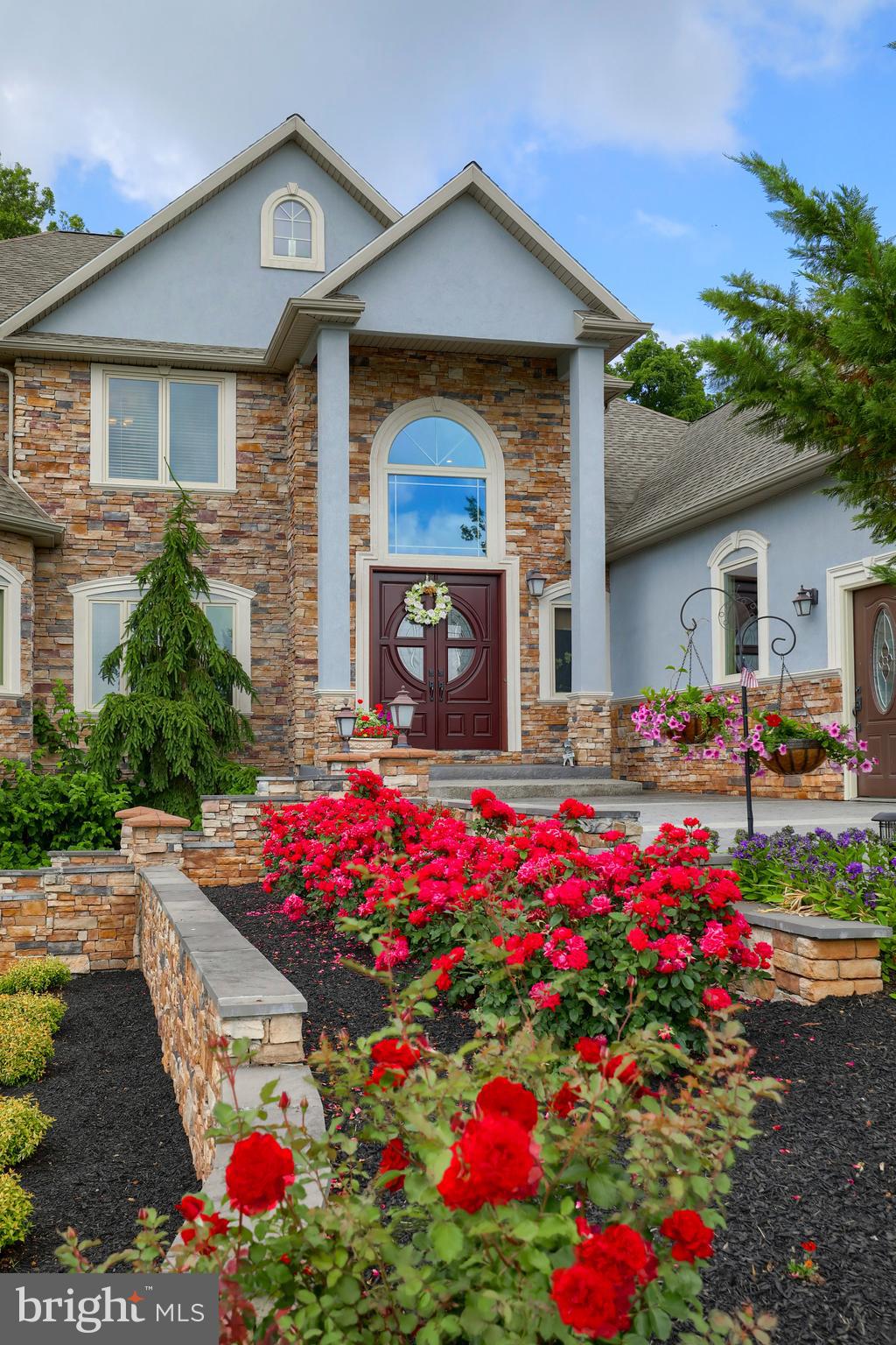70 Horseshoe Trail Road Denver, PA 17517 - Photo 15 of 128 a front view of house with yard and flowers