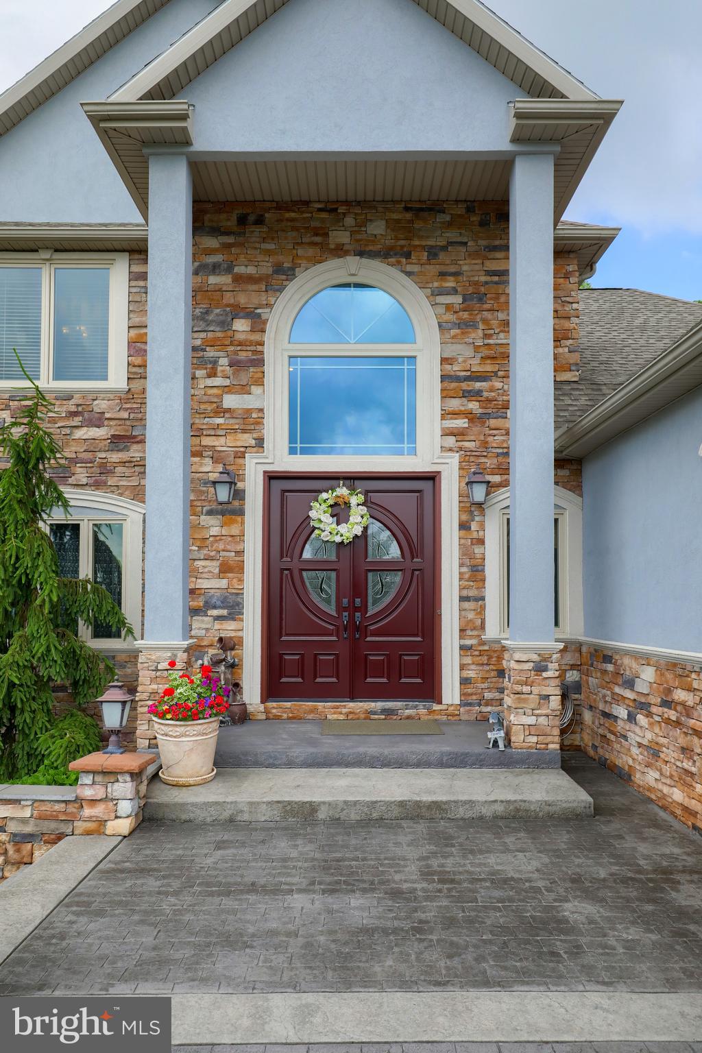 70 Horseshoe Trail Road Denver, PA 17517 - Photo 16 of 128 a front view of a house with garage