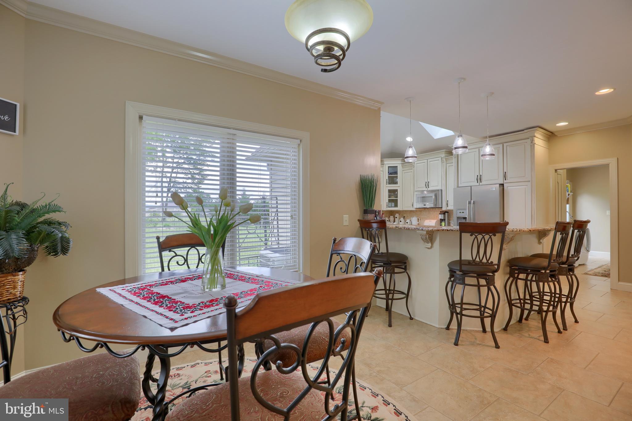 70 Horseshoe Trail Road Denver, PA 17517 - Photo 28 of 128 a view of a dining room with furniture and window