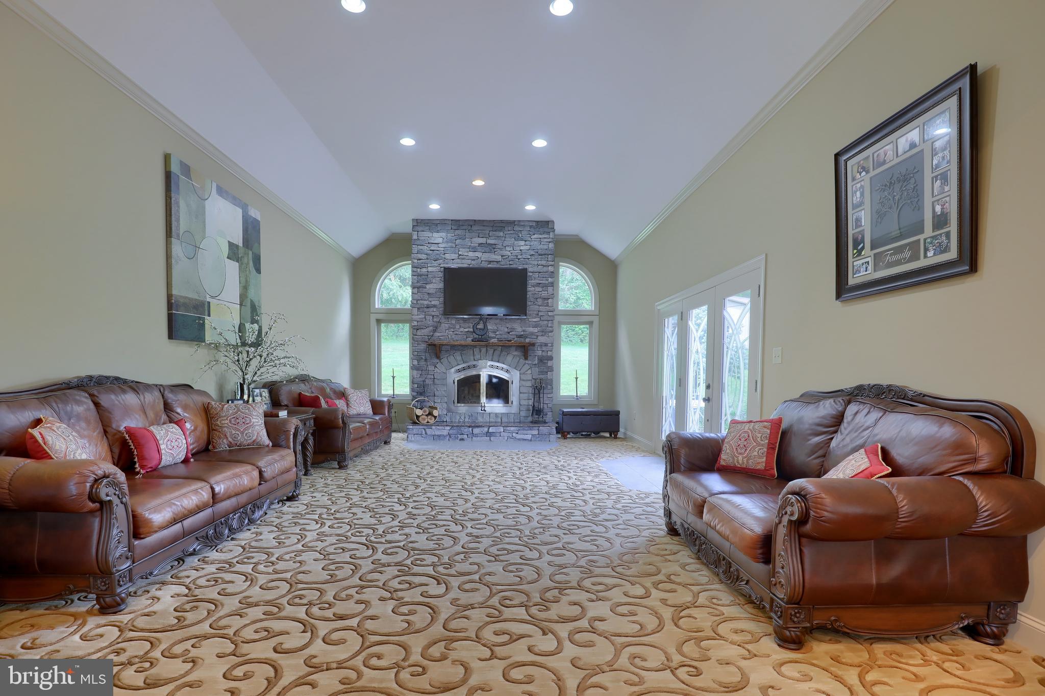70 Horseshoe Trail Road Denver, PA 17517 - Photo 41 of 128 a living room with furniture and a fireplace