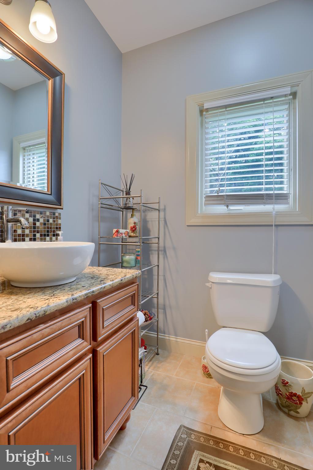 70 Horseshoe Trail Road Denver, PA 17517 - Photo 53 of 128 a bathroom with a toilet a sink and a window