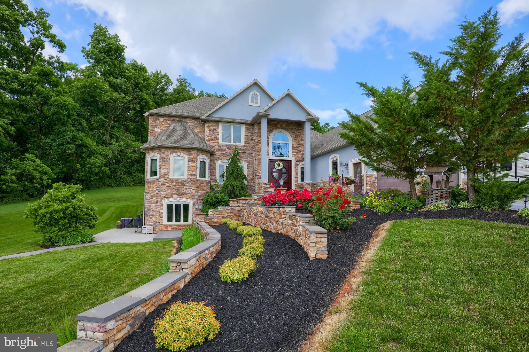 70 Horseshoe Trail Road Denver, PA 17517 - Photo 10 of 128 a front view of a house with yard and green space
