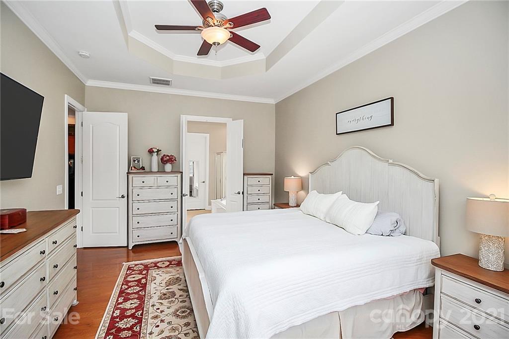 2018 Dynasty Court Fort Mill, SC 29708 - Photo 16 of 31 a bedroom with a bed and a flat tv screen on dresser