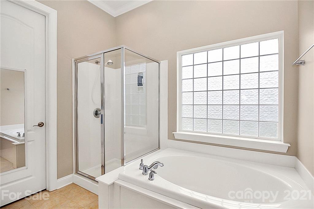 2018 Dynasty Court Fort Mill, SC 29708 - Photo 18 of 31 a white bath tub sitting next to a window
