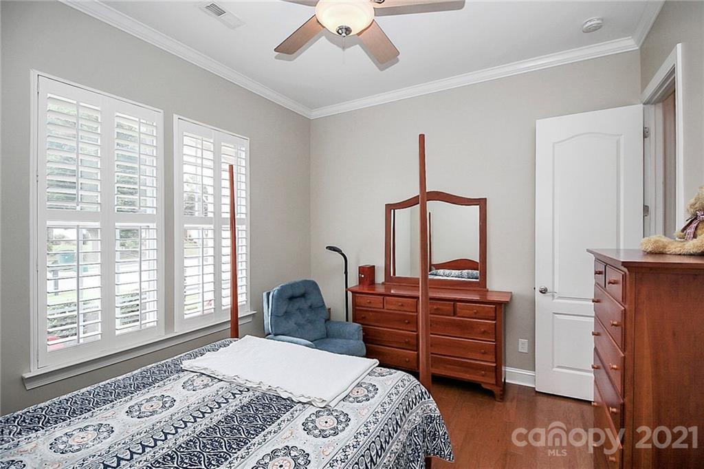2018 Dynasty Court Fort Mill, SC 29708 - Photo 19 of 31 a bedroom with a bed and furniture