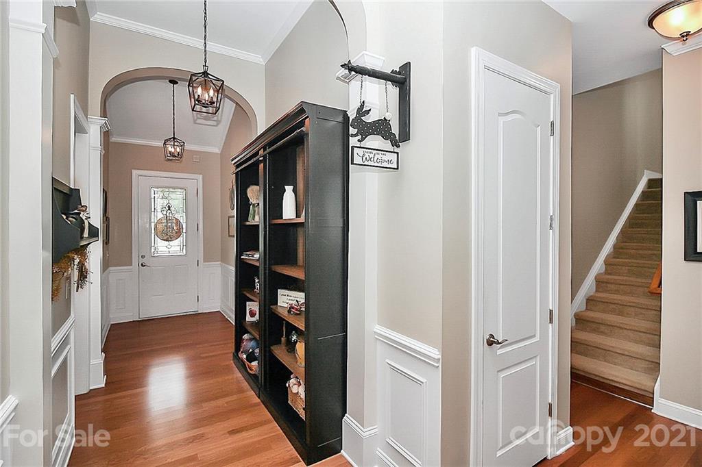 2018 Dynasty Court Fort Mill, SC 29708 - Photo 3 of 31 a view of a hallway with wooden floor and entryway