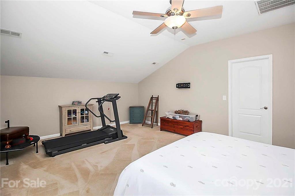 2018 Dynasty Court Fort Mill, SC 29708 - Photo 22 of 31 a bedroom with bed and wooden floor