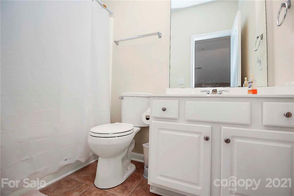 2018 Dynasty Court Fort Mill, SC 29708 - Photo 24 of 31 a bathroom with a toilet sink and mirror