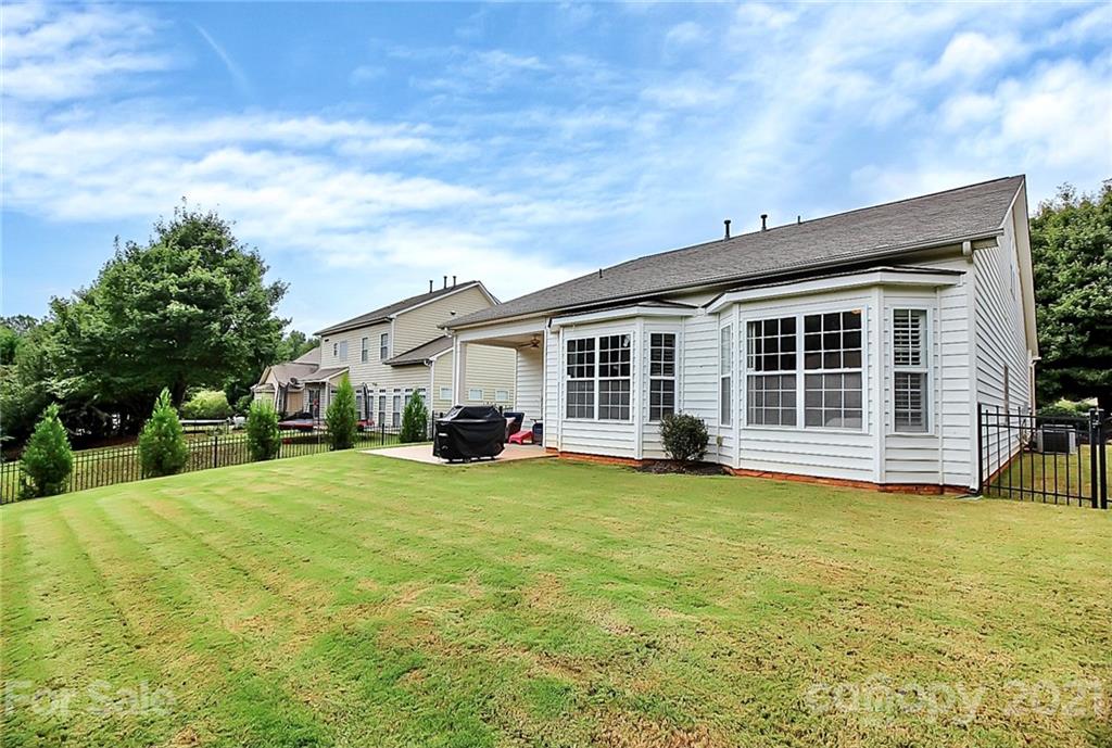 2018 Dynasty Court Fort Mill, SC 29708 - Photo 27 of 31 a view of a house with swimming pool and a yard