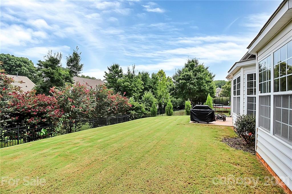 2018 Dynasty Court Fort Mill, SC 29708 - Photo 28 of 31 a view of a backyard with table and chairs and potted plants