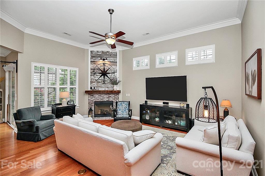 2018 Dynasty Court Fort Mill, SC 29708 - Photo 4 of 31 a living room with furniture a flat screen tv and a fireplace