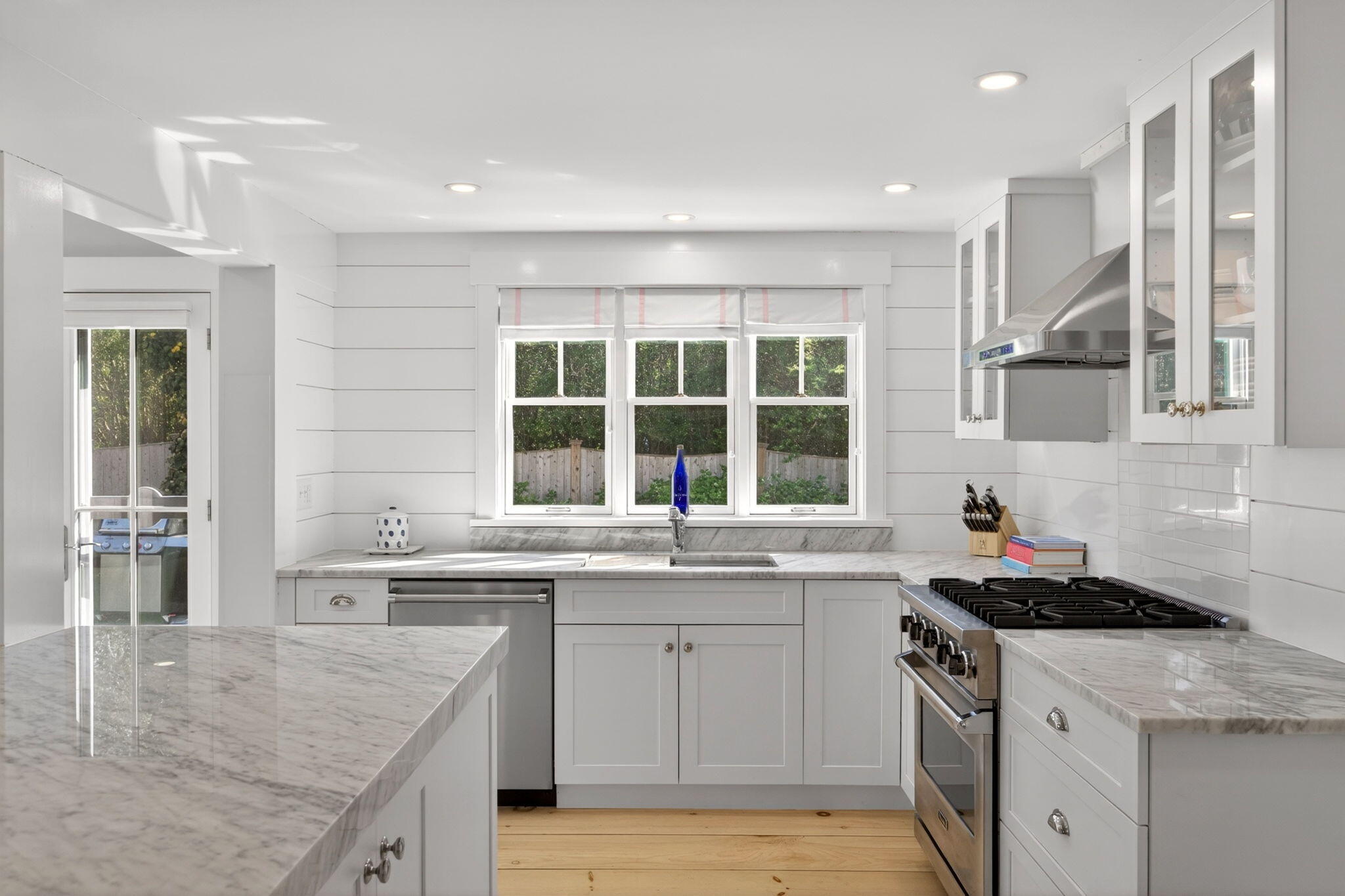 320 Old Harbor Road Chatham, MA 02633 - Photo 19 of 58 a kitchen with a sink stove and cabinets
