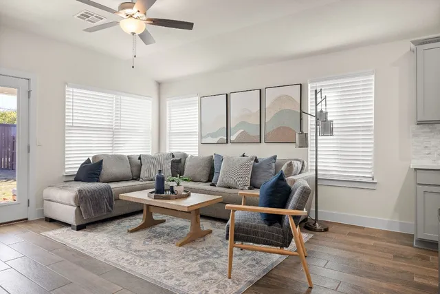 a living room with furniture and a large window