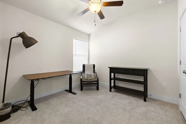 a bedroom with furniture and a window