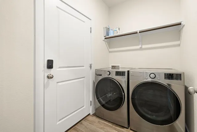 a view of a hallway with washer and dryer