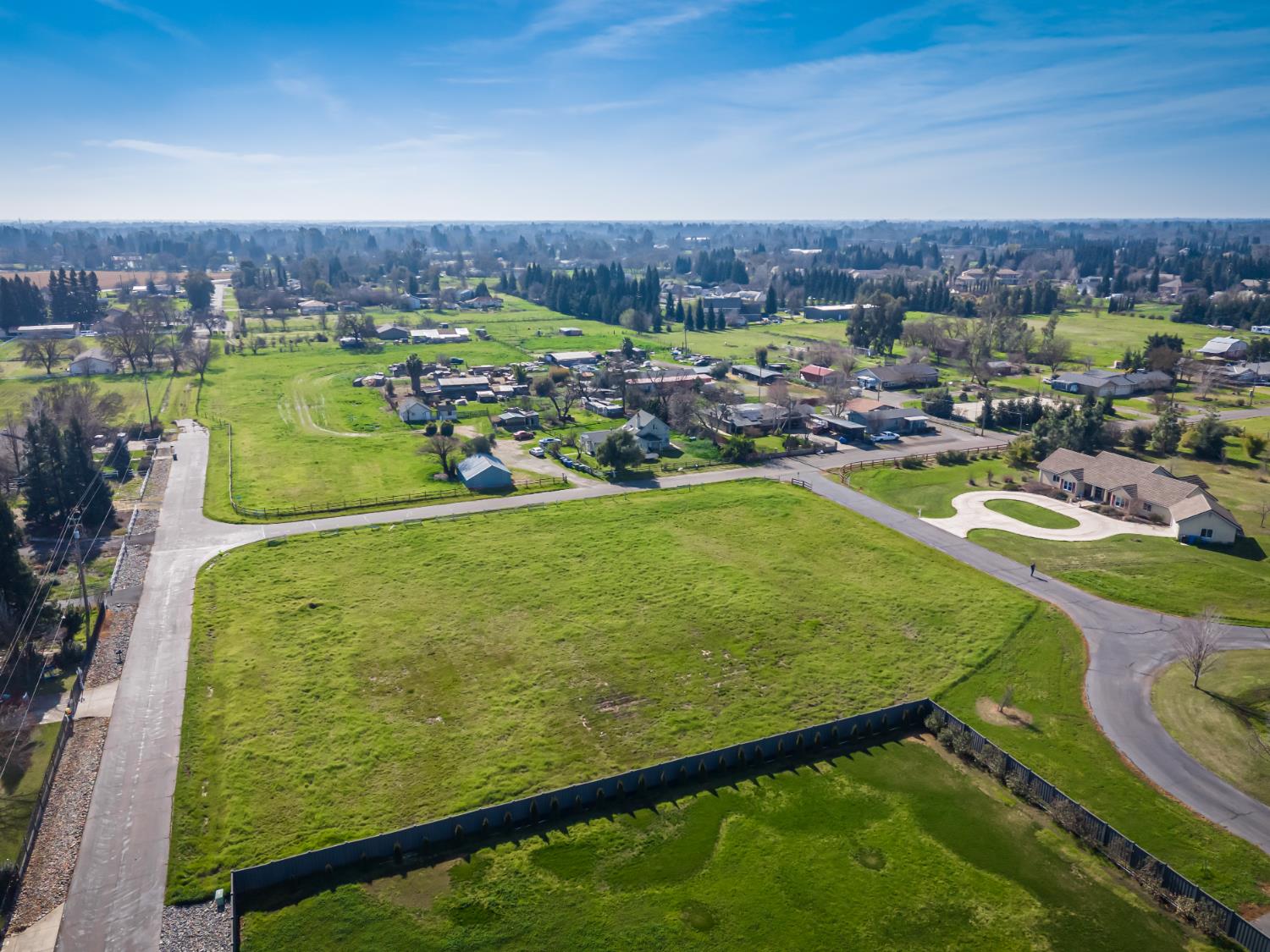 10685 Halfway Road Elk Grove, CA 95624 - Photo 8 of 19 a view of a pool with a table and chairs