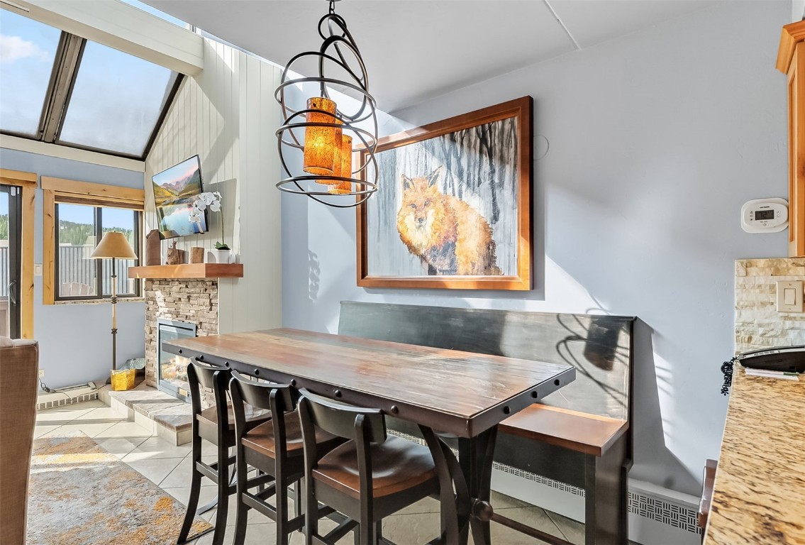 601 Village Road, Unit 501 Breckenridge, CO 80424 - Photo 13 of 50 a dining room with furniture and window