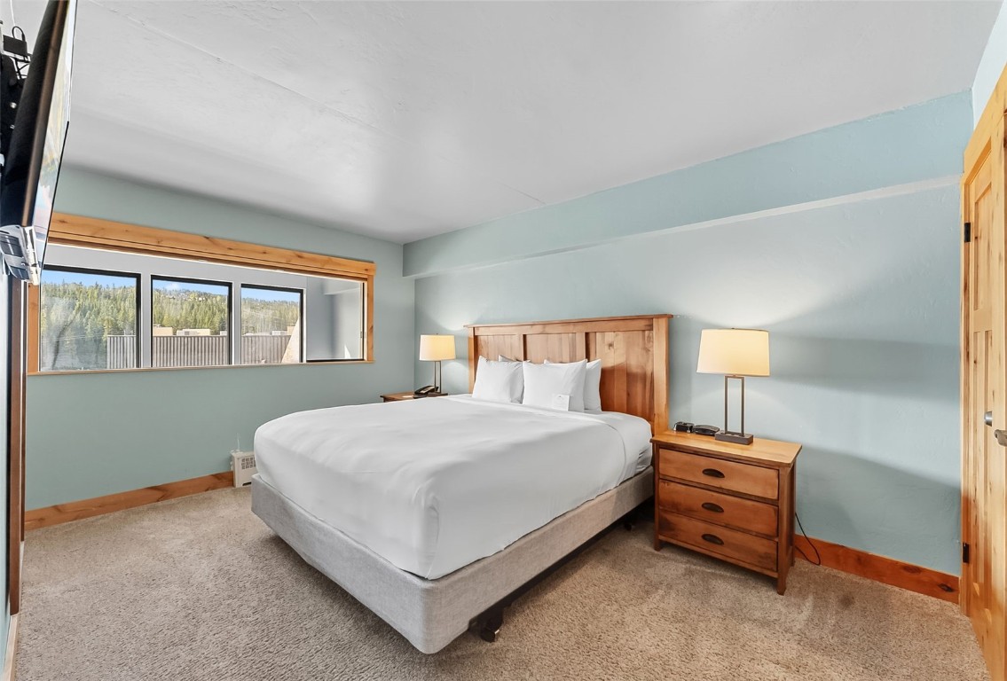 601 Village Road, Unit 501 Breckenridge, CO 80424 - Photo 15 of 50 a bedroom with a bed and a window