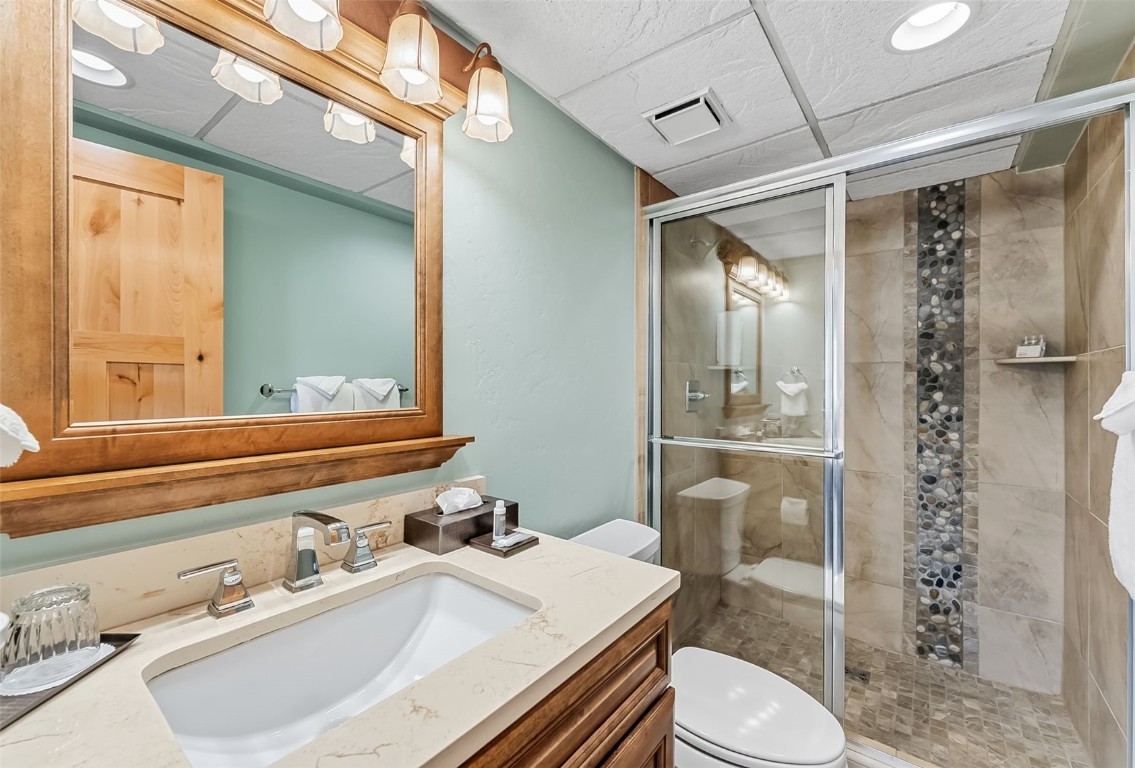 601 Village Road, Unit 501 Breckenridge, CO 80424 - Photo 22 of 50 a bathroom with a sink toilet vanity and shower