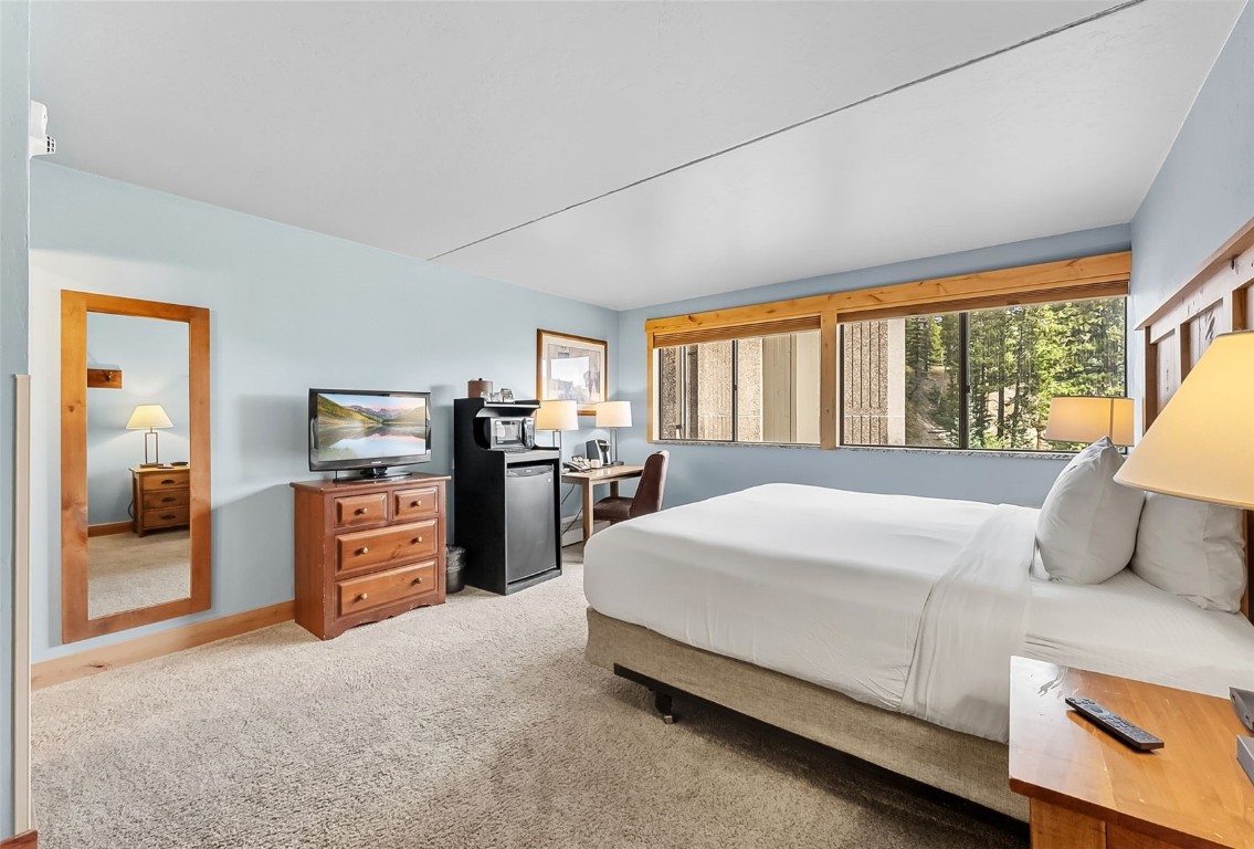 601 Village Road, Unit 501 Breckenridge, CO 80424 - Photo 25 of 50 a bedroom with a large bed and a large window