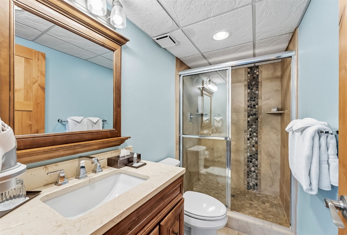 601 Village Road, Unit 501 Breckenridge, CO 80424 - Photo 27 of 50 a bathroom with a sink a toilet and shower