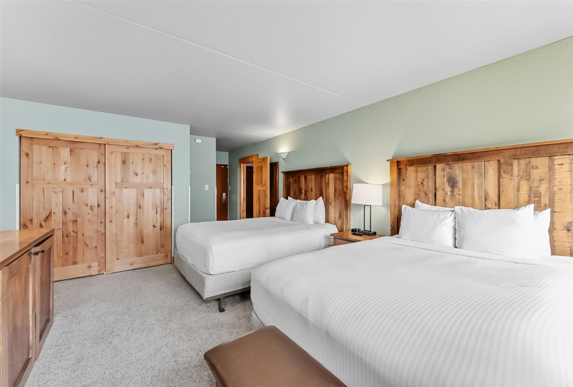 601 Village Road, Unit 501 Breckenridge, CO 80424 - Photo 31 of 50 a bedroom with bed and a night stand