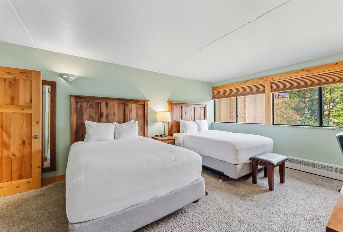 601 Village Road, Unit 501 Breckenridge, CO 80424 - Photo 32 of 50 a bedroom with two beds and a large window
